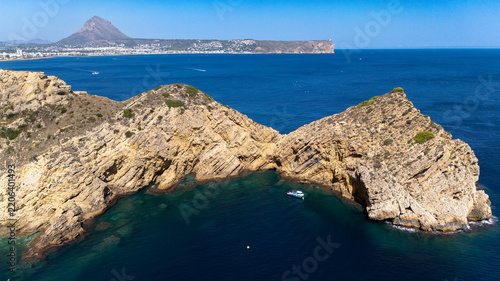 Javea coast aerial view with montgo mountain and boats