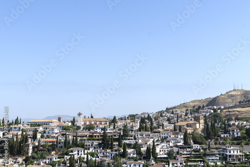 View of Granada, Spain, looking out over the city and the surrounding Sierra Nevada mountain range from an elevated vantage point