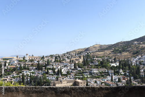 View of Granada, Spain, looking out over the city and the surrounding Sierra Nevada mountain range from an elevated vantage point