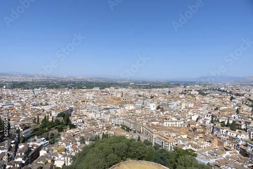 View of Granada, Spain, looking out over the city and the surrounding Sierra Nevada mountain range from an elevated vantage point