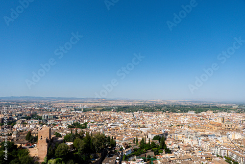 View of Granada, Spain, looking out over the city and the surrounding Sierra Nevada mountain range from an elevated vantage point