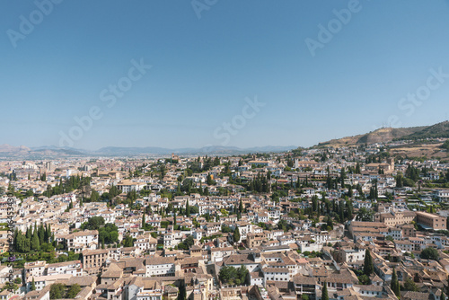 View of Granada, Spain, looking out over the city and the surrounding Sierra Nevada mountain range from an elevated vantage point
