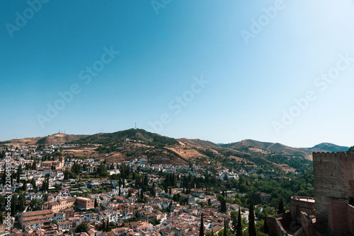View of Granada, Spain, looking out over the city and the surrounding Sierra Nevada mountain range from an elevated vantage point
