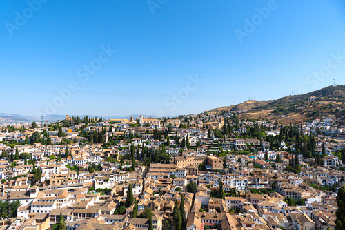 View of Granada, Spain, looking out over the city and the surrounding Sierra Nevada mountain range from an elevated vantage point