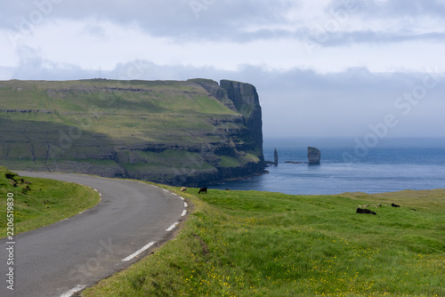 View of Risin og Kellingin or The Giant and the Witch , Standing Stone at the northern coast of the island of Eysturoy in the Faroe Islands.
