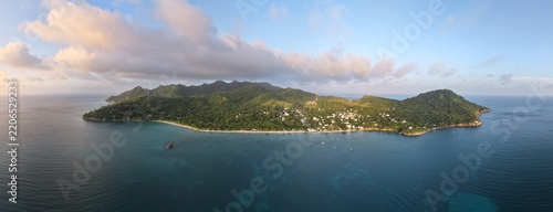 Panoramic Aerial View of Providencia Island Surrounded by Deep Blue Caribbean Sea Waters and Warm Sunset Light, San Andres Archipelago, Colombia Travel Destination Microstock Photography Background