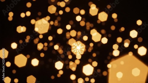 Golden Bokeh Lights Falling Sparkling Effect in Dark Background