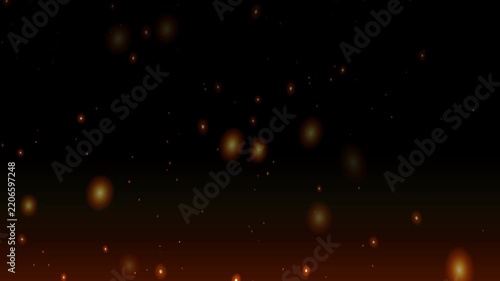 Abstract glowing fire particles rising on dark background