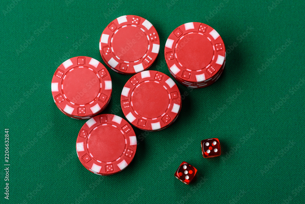 Fototapeta premium Multicolored casino chips as a conceptual backdrop for gambling games like poker, blackjack