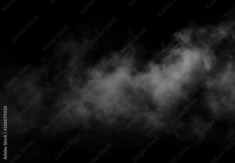 Obraz premium Wispy white smoke or steam billowing against a dark black background, creating an atmospheric texture or overlay effect for design projects.