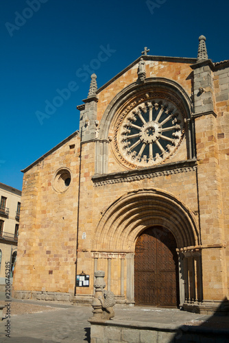 Historic Romanesque San Pedro Apostol Church Facade with Rose Window in Avila
