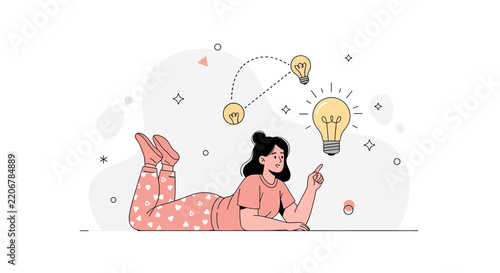 Young woman lying down pointing at a light bulb representing a brilliant idea