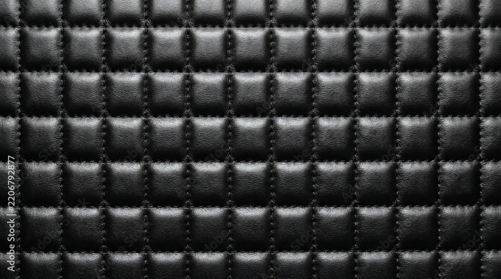 Fototapeta premium Close Up Texture of Black Quilted Synthetic Leather with Square Grid Pattern and Detailed Stitching for Luxury Upholstery Background