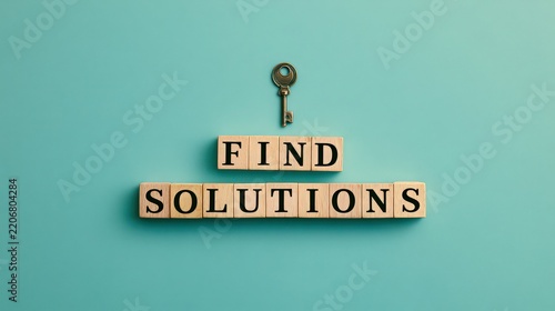 Letter blocks arranged to spell find solutions accompanied by an antique key on turquoise.