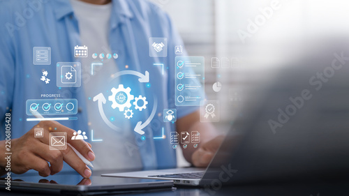 AI Workflow Automation with business professional using tablet and laptop, digital process dashboard with gears, progress checklist and enterprise workflow interface for operational efficiency