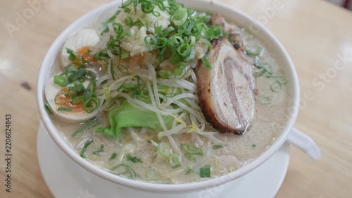 Generous bowl of Japanese ramen with pork and vegetables