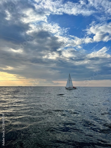 Yacht at sea at sunset