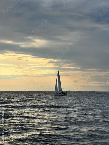 Yacht at sea at sunset