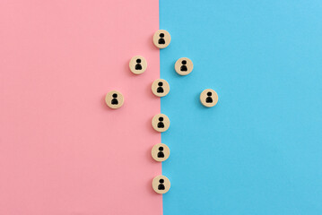 Wooden cubes with people icons over blue background, human resources and management concept