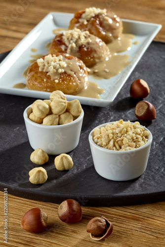 Delicious authentic Turkish syrupy dessert with tahini and chopped hazelnuts