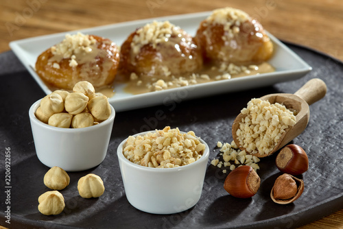 Delicious authentic Turkish syrupy dessert with tahini and chopped hazelnuts