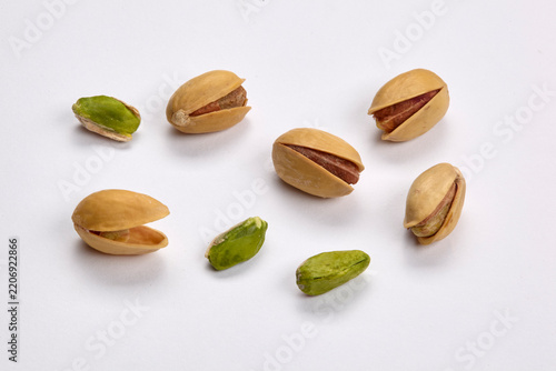 Premium Pistachio Nuts and Green Kernels Isolated on White