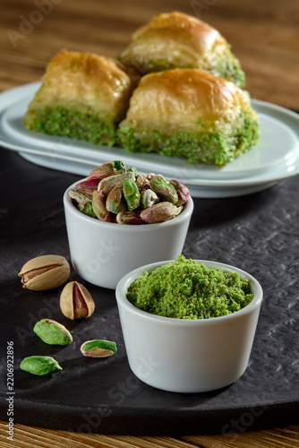 Delicious authentic Turkish dessert baklava with pistachio filling and nuts served on a plate