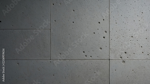 Modern architectural concrete tile wall background with porous texture and formwork holes