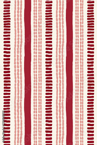 Hand-painted vertical red and pink stripes with dotted brush marks create a rhythmic seamless pattern on a warm cream background.