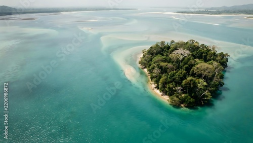 Beautiful Tropical Island with Lush Greenery Surrounded by Shallow Crystal Clear Water