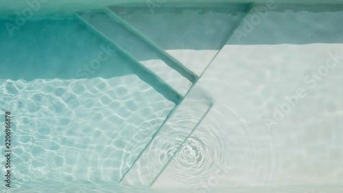 Close Up View Of Ripples And Waves Under Clear Transparent Water Surface With Reflective Light Effects
