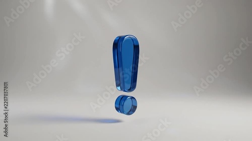 Blue glass exclamation mark rotating against a light studio background
