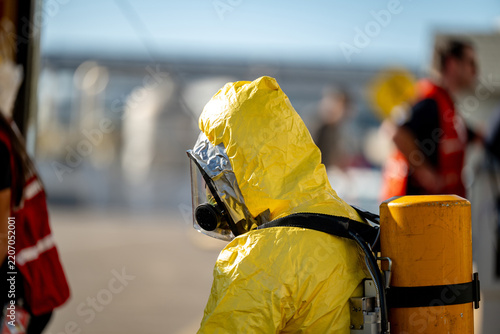 Man in a hazmat suit with air tank