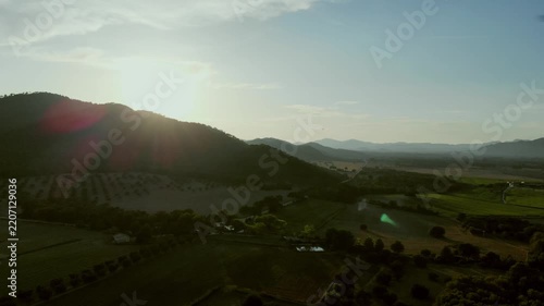 Sunset over rolling hills and farmland