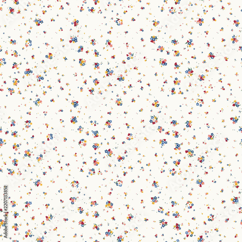 Seamless Ditsy Floral Pattern with Scattered Colorful Blooms on a Light Cream Backdrop