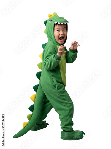 Asian boy wearing a green dinosaur costume roaring playfully