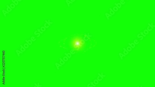 Golden glitter sparkle dual crossing orbiting halos and magical dust stream bright yellow light burst and lens flare effect on a solid green screen background