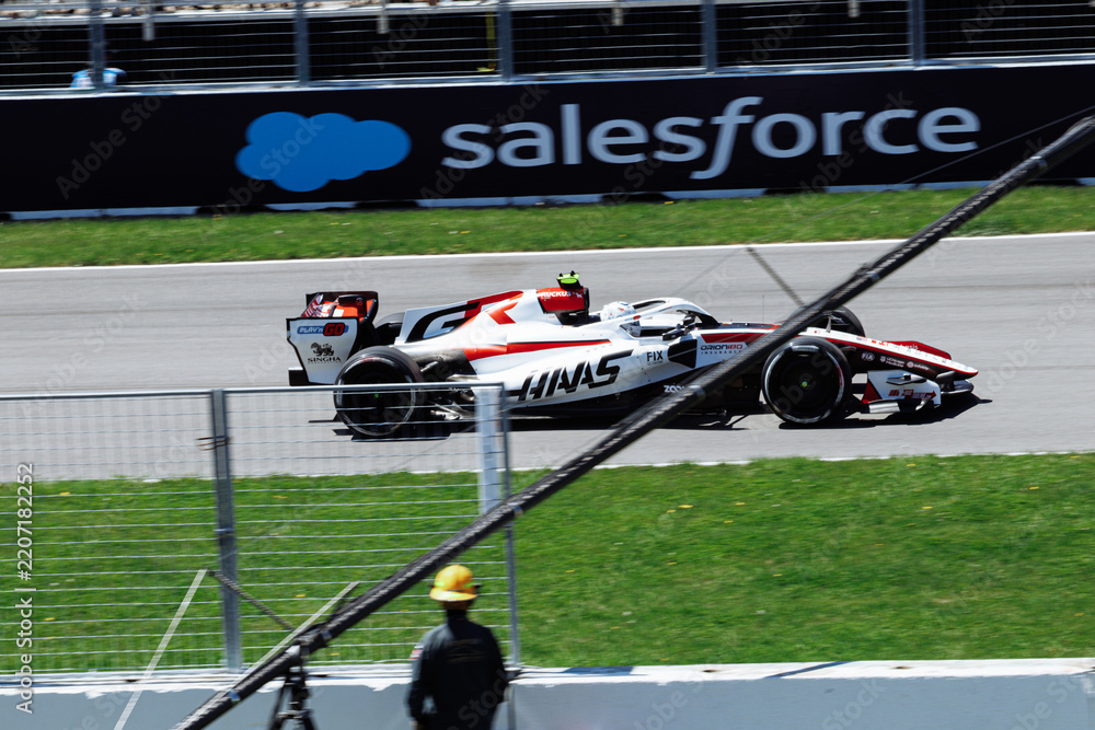 Obraz premium May 24, 2026, Montreal, Canada, Esteban Ocon races a Haas F1 car at Circuit Gilles-Villeneuve. g.