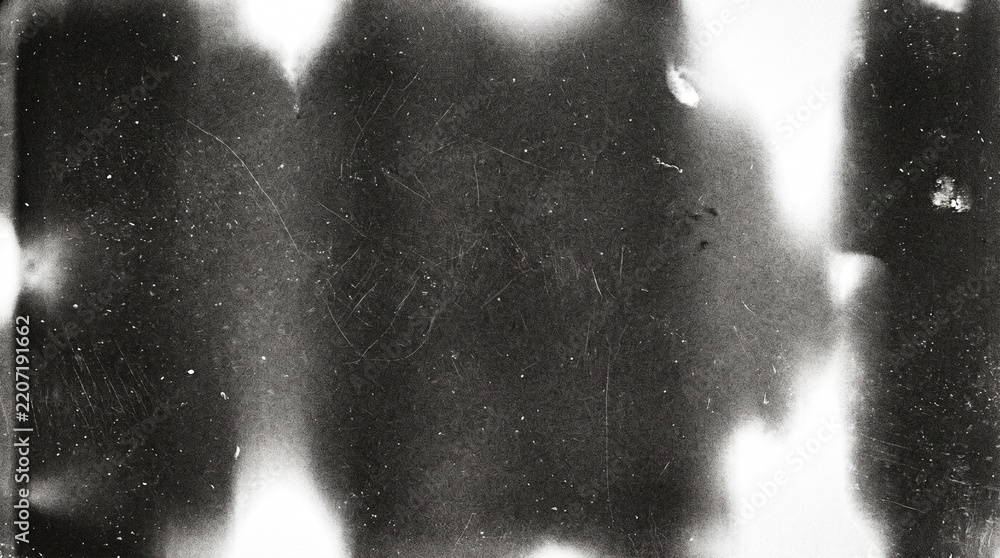 Fototapeta premium Old film texture with scratches, noise and light leaks. Realistic transparent overlay film texture in black-white, dust and grain. Distressed retro movie or photo negative effect of cinema nostalgia
