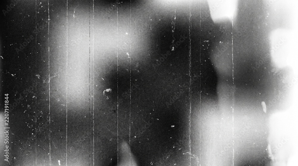 Fototapeta premium Old film texture with scratches, noise and light leaks. Realistic transparent overlay film texture in black-white, dust and grain. Distressed retro movie or photo negative effect of cinema nostalgia