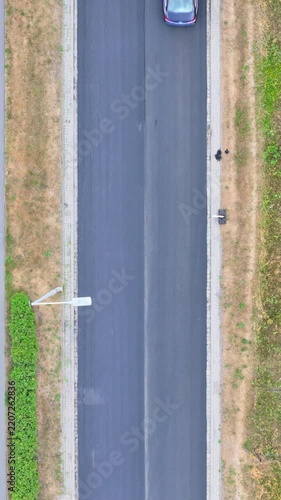 Aerial Top-Down View of Road Construction with Traffic Flowing on the Adjacent Lane