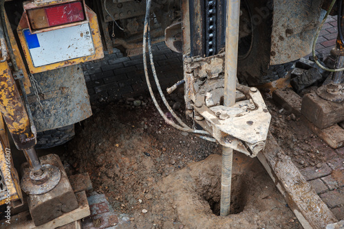 Borehole drilling into soil and ground during geotechnical construction investigation, testing and engineering work examining subsurface conditions