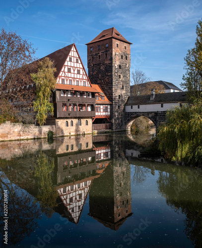 Panoramic  view of  medieval traditional architecture and towers reflecting in the river water in Nuremberg, Bavaria, Germany.
