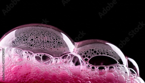 pink bubble foam texture effect on black background macro abstract