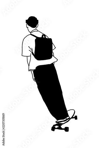 silhouette of a boy riding a skateboard