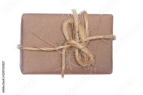 Gift package with rustic wrapping set against a white background.