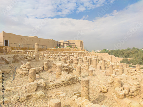 Fotografie Low walls and columns of natural stone mark the location of former buildings in