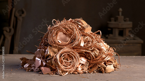 Curled wire and chopped metal sit in a dense scrap pile