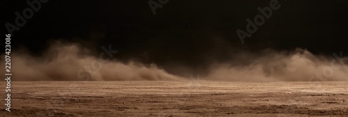Dust storm blowing across dry ground