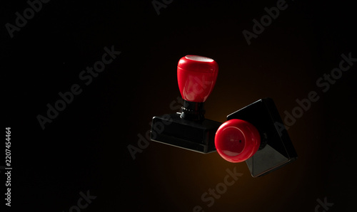 Approved sign and stamper on document fly on isolated black background. Approved Paid Deal stamp from wood plastic for manager and office float in mid air
